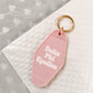 Delta Phi Epsilon Motel Hotel Key Chain in Soft pink with white letters and gold ring. DPhiE
