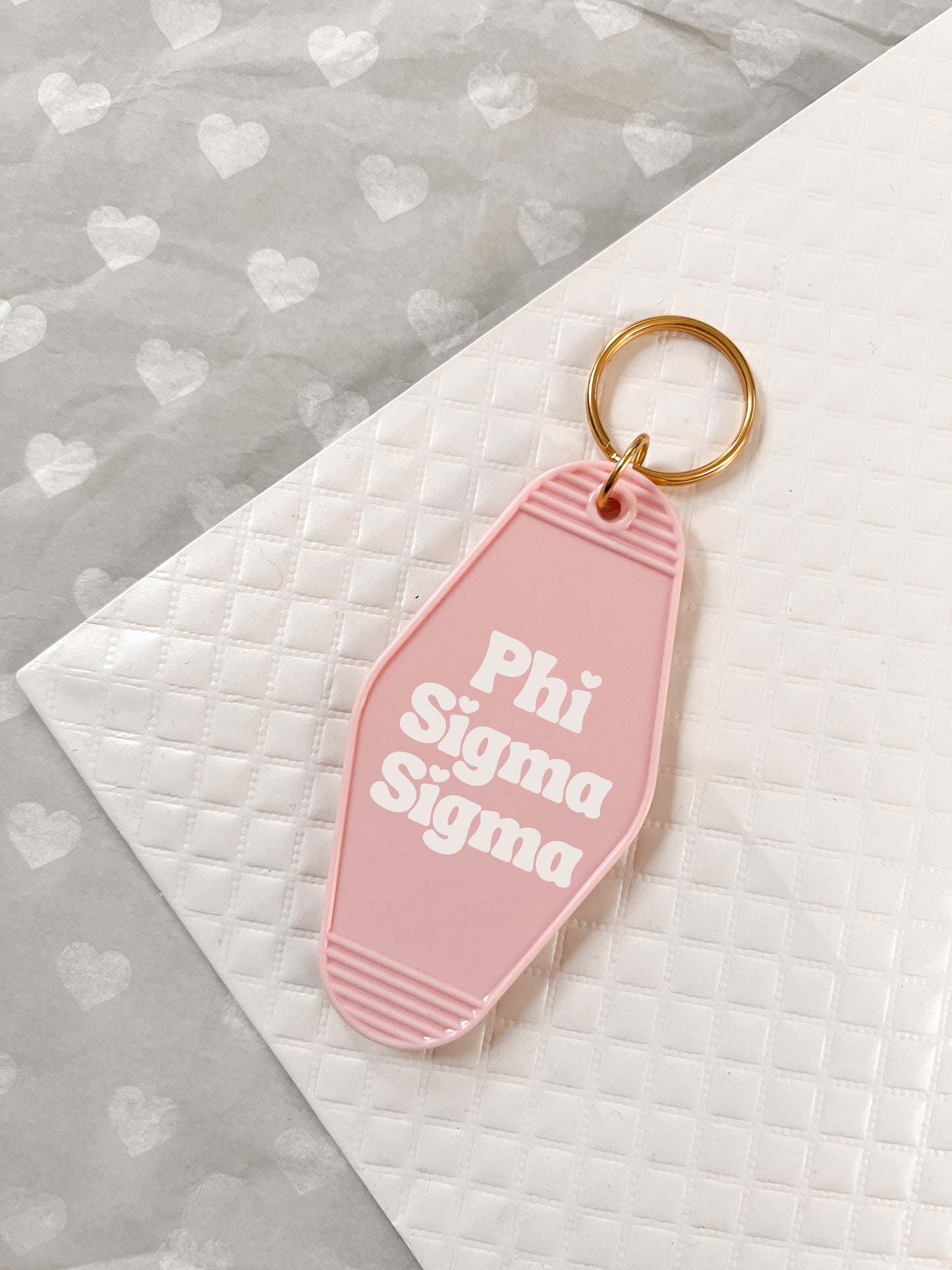 Phi Sigma Sigma Motel Hotel Key Chain in Soft pink with white letters and gold ring. PhiSig PSS