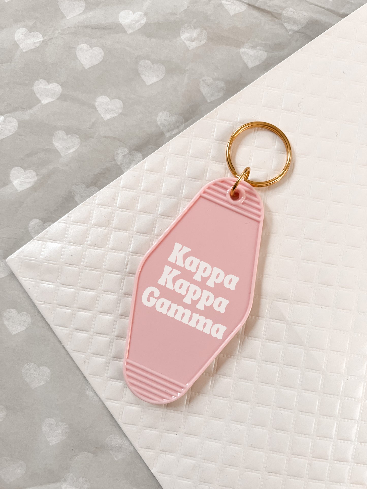 Kappa Kappa Gamma Motel Hotel Key Chain in Soft pink with white letters and gold ring. KKG