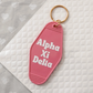 Alpha Xi Delta Motel Hotel Key Chain in Hot pink with white letters and gold ring. AXiD AXD