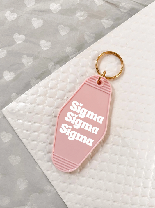 Sigma Sigma Sigma Motel Hotel Key Chain in Soft pink with white letters and gold ring. TriSigma Tri Sig