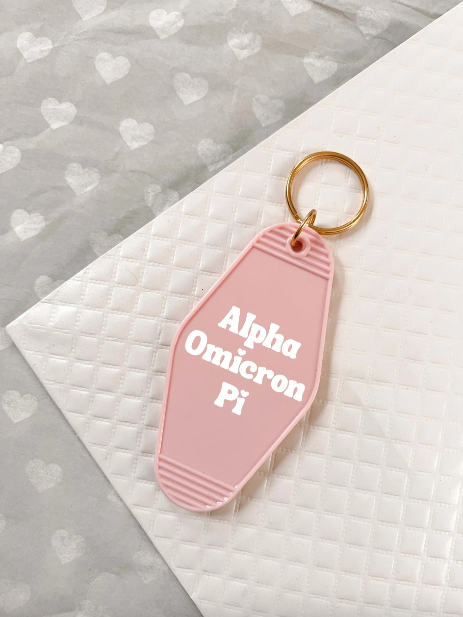 Alpha Omicron Pi Motel Hotel Key Chain in Soft pink with white letters and gold ring. AOII AOPI