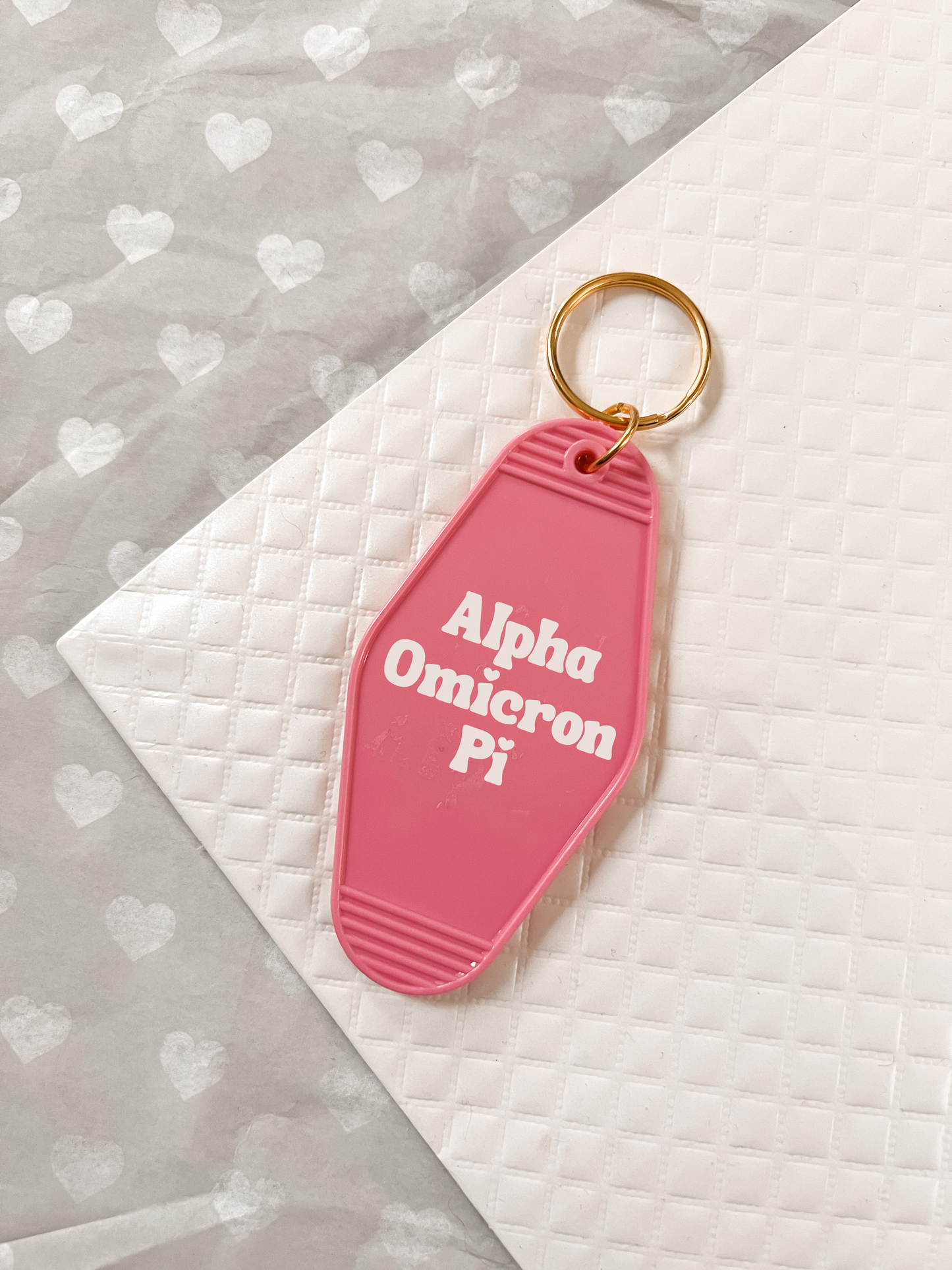 Alpha Omicron Pi Motel Hotel Key Chain in Hot pink with white letters and gold ring. AOII AOPI