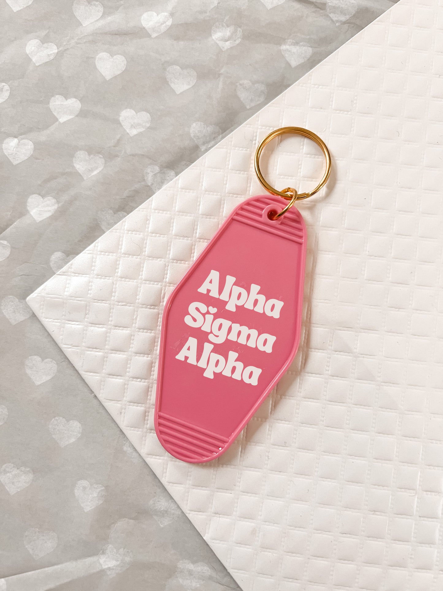 Alpha Sigma Alpha Motel Hotel Key Chain in Hot pink with white letters and gold ring. ASA