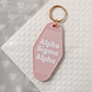 Alpha Sigma Alpha Motel Hotel Key Chain in Soft pink with white letters and gold ring. ASA