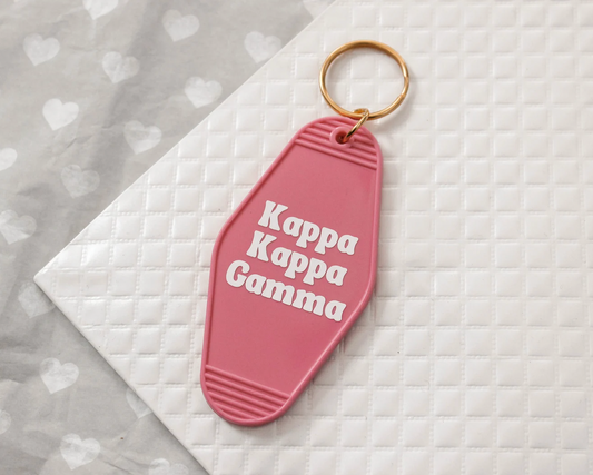 Kappa Kappa Gamma Motel Hotel Key Chain in SHot pink with white letters and gold ring. KKG
